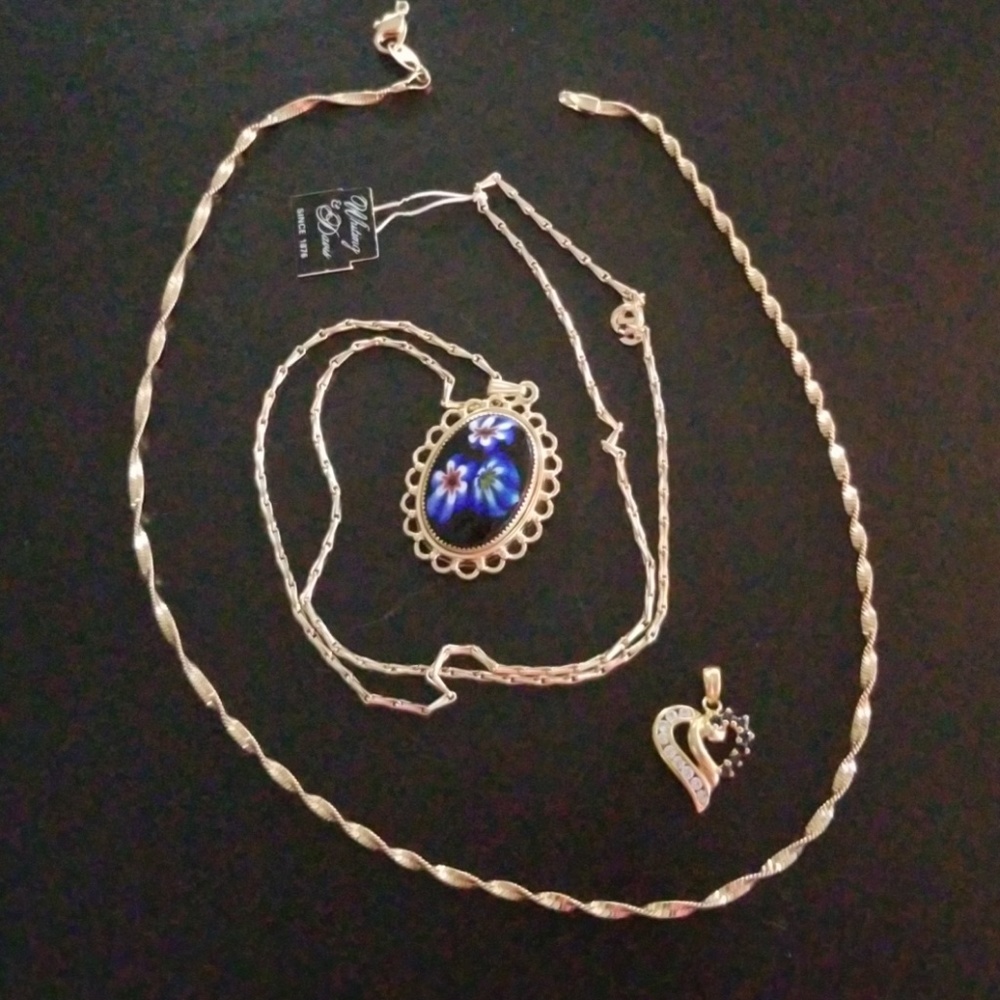 Two beautiful gold necklaces and heart pendant